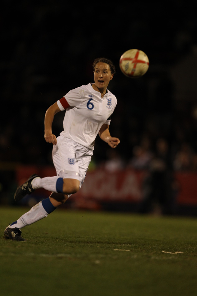 Casey Stoney in action for England against USA.